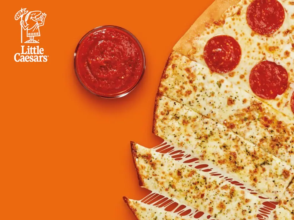 Orange image of a pizza that is half pepperoni pizza half breadsticks. Also included is a cup of dipping sauce. In the top left corner is the Little Caesars logo.