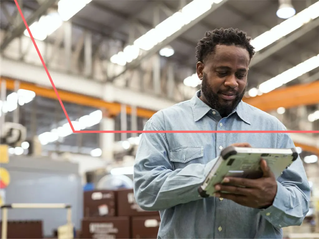 Increase Machine Efficiency with Asset Performance Management in Manufacturing Industry. A Male Production Control Manager using a digital tablet in the production line to remote asset monitoring , asset health for reduce production downtime and predictive maintenance.