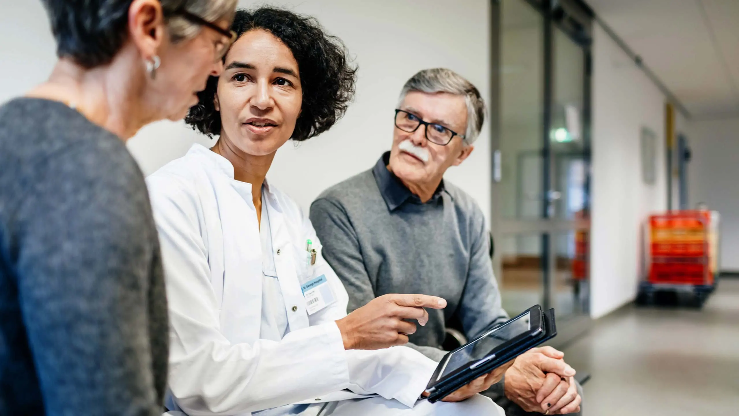 Care provider connecting with patient to give proper care plan on tablet