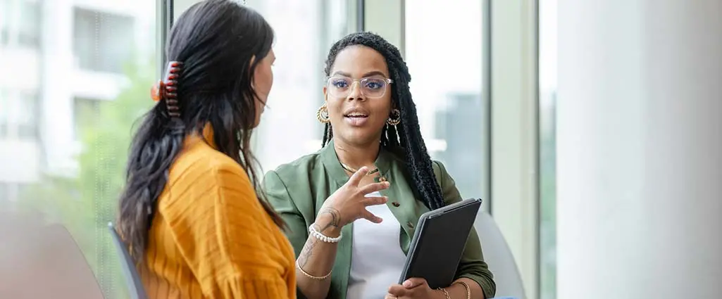 Coworkers discussing digital ethics in the workplace