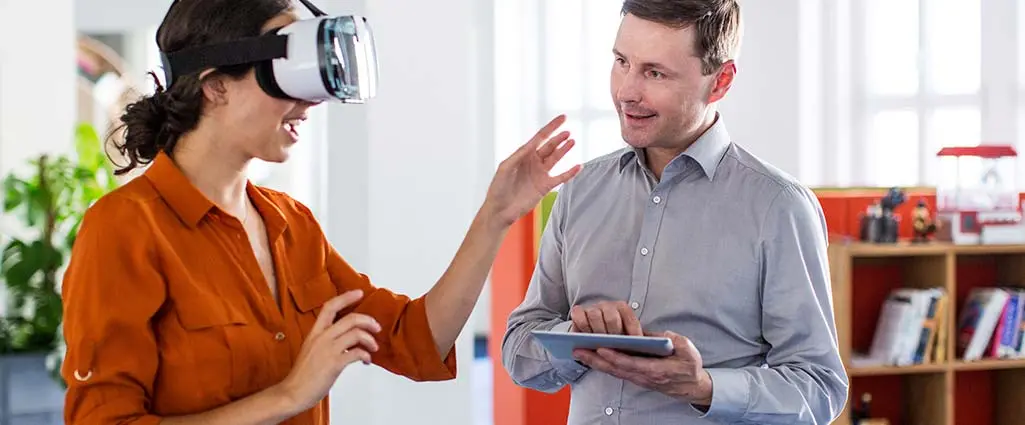 Two colleagues at an office working on virtual reality software