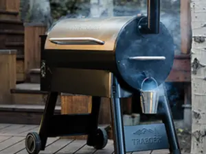 A Traeger Grill Pro Series with smoke coming out