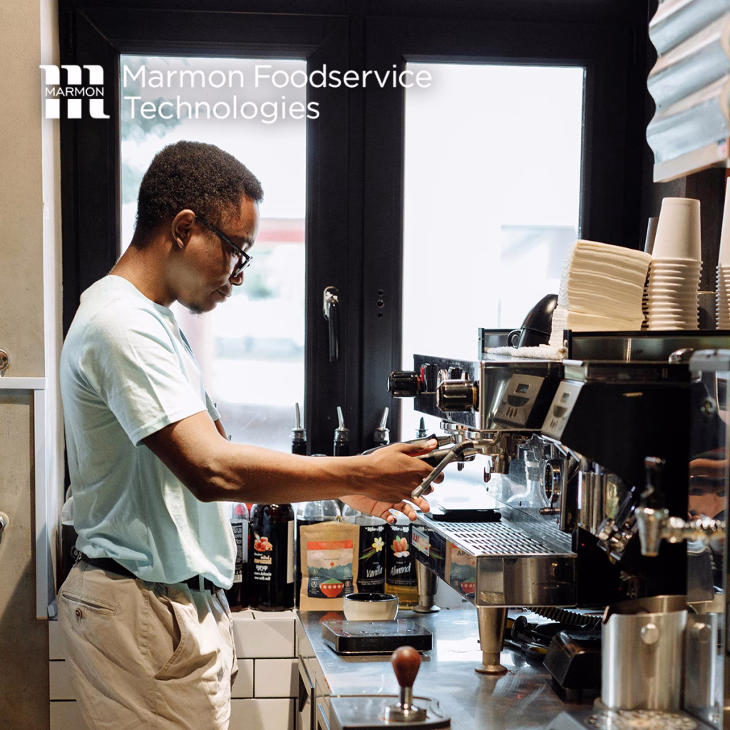 Foodservice employee using cafe equipment